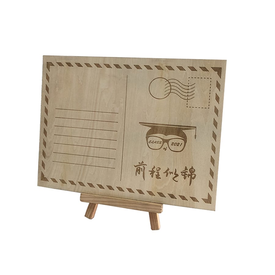 A wooden postcard with engraved lines, a graduation cap marked "CLASS 2021," and Chinese characters, displayed on a small wooden easel—perfect as a unique Wooden Business Card or keepsake for commercial events.