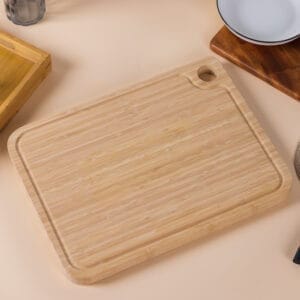 Rectangular wooden cutting board with a handle