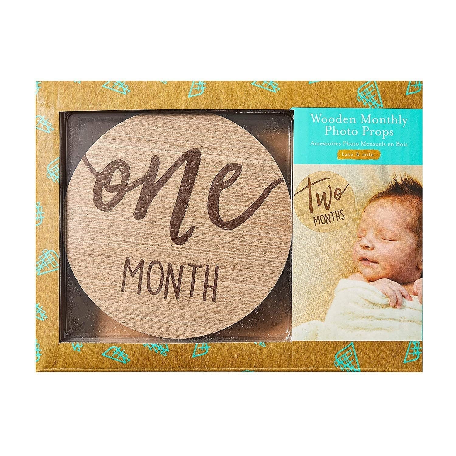 A boxed set labeled "Wooden Monthly Photo Props" featuring baby growth month cards—a wooden disc marked "one month"—and packaging with a photo of a sleeping baby beside a "two months" marker.