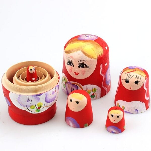 Five hand-painted Matryoshka dolls, also known as Russian nesting dolls, are displayed separated and arranged from largest to smallest, showcasing charming wooden giftware.