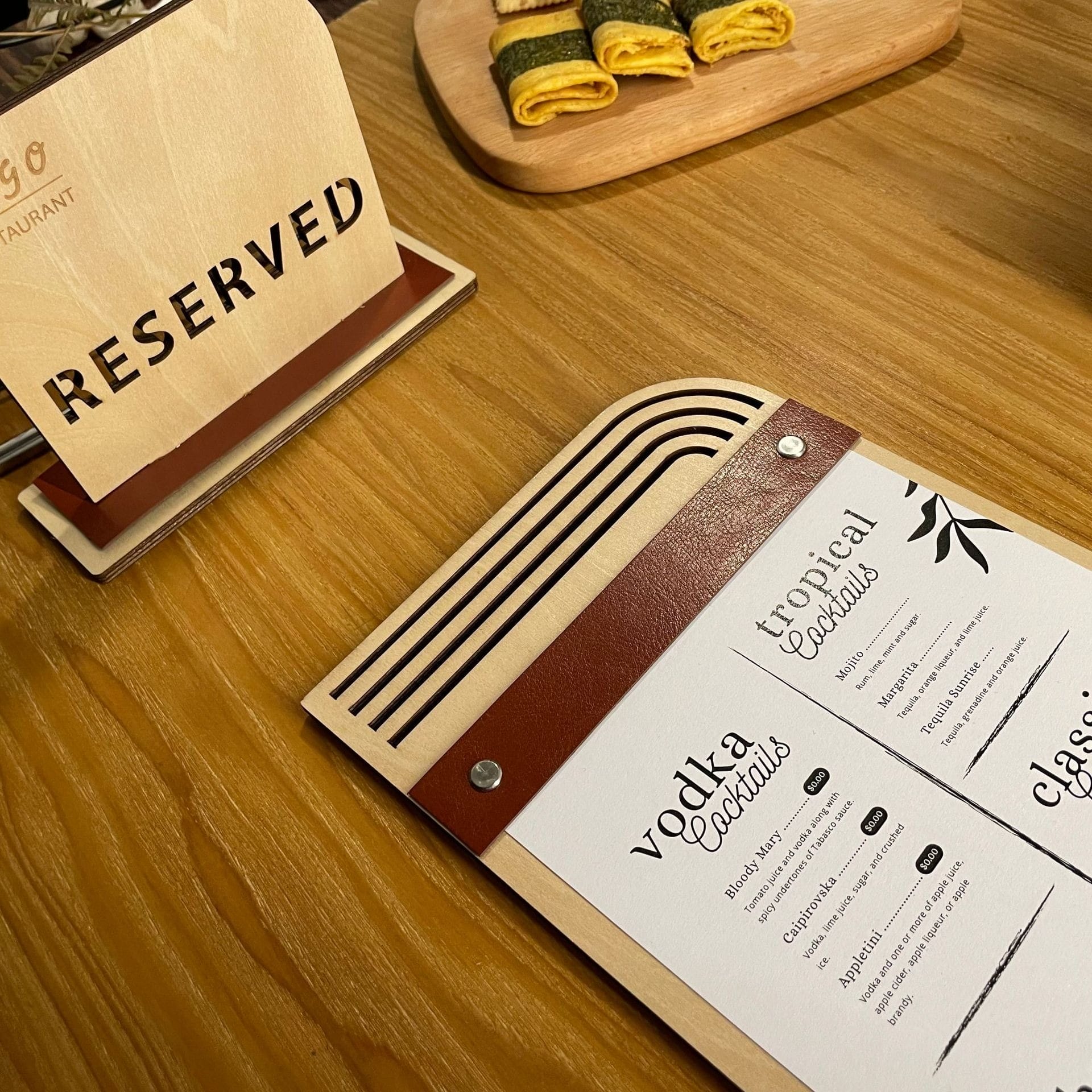 Wooden menu board with "Reserved" sign and drink menu featuring cocktails. Eco-friendly design with replaceable inserts.