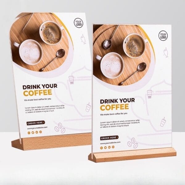 Two wooden coffee shop menu stands with images of coffee and text: "Drink Your Coffee.
