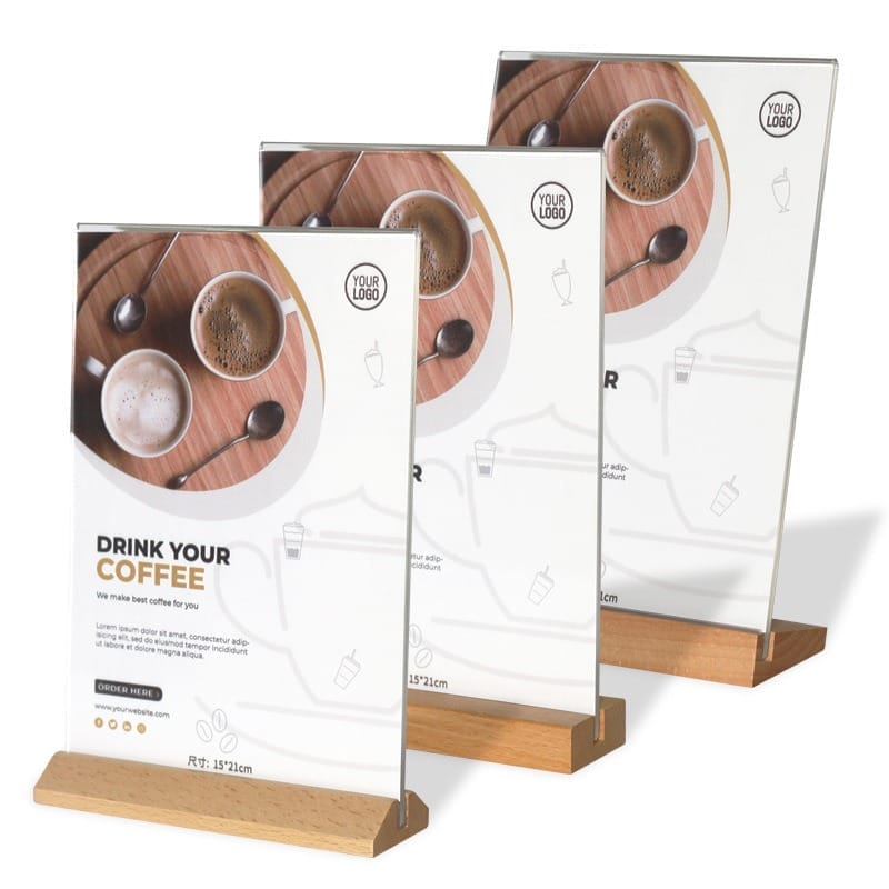 Three wooden tabletop menu holders displaying coffee shop advertisements.
