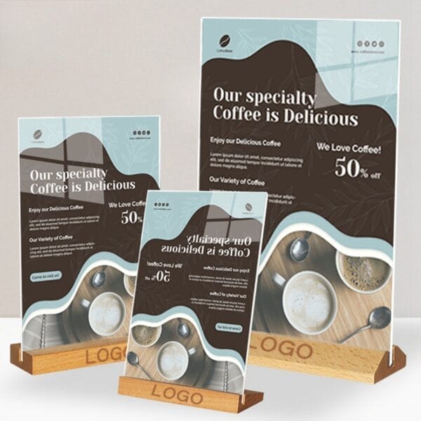Three wooden tabletop menu holders display coffee shop advertisements with "Our specialty Coffee is Delicious" and "50% off.