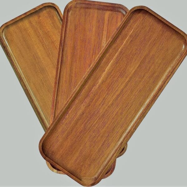 Three Japanese Style Wooden Trays with rounded corners are arranged in a fanned-out pattern against a plain background, highlighting their elegant design.