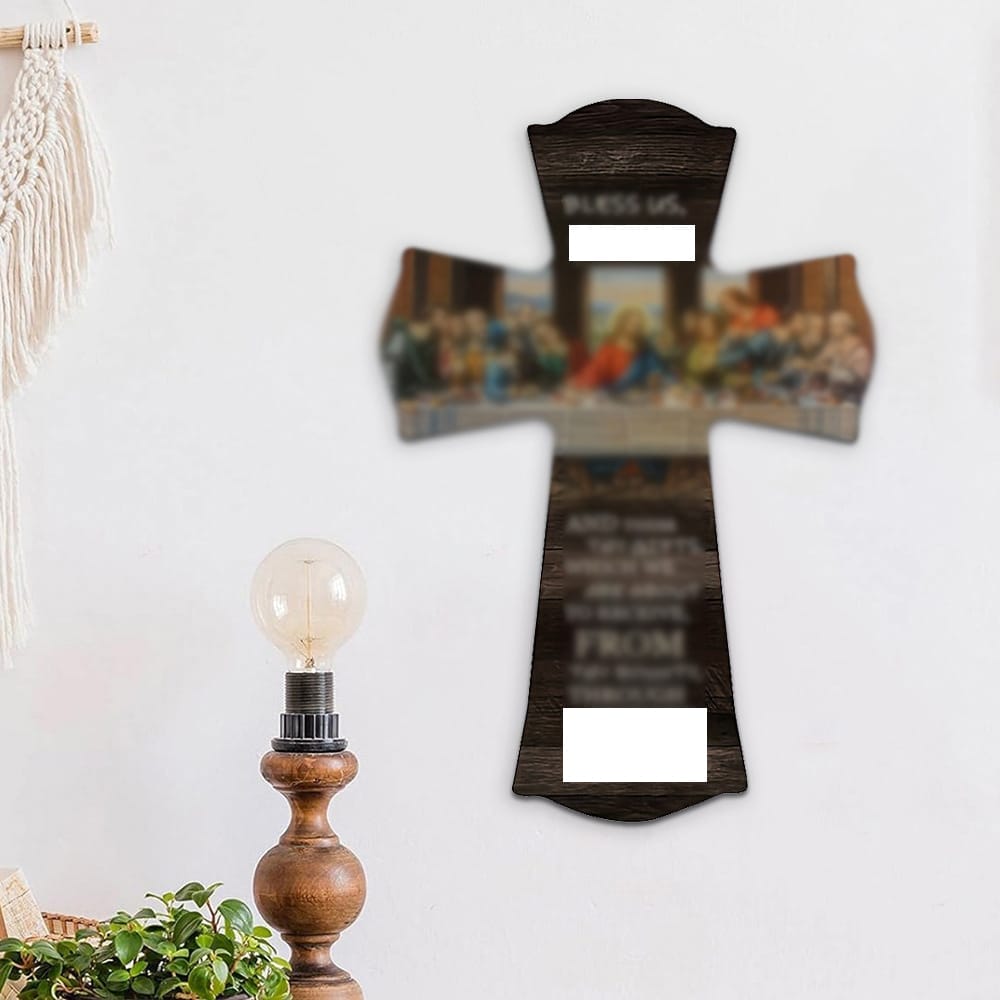 An eco-friendly wooden wall cross featuring the Last Supper image and text, mounted above a wooden lamp and macrame wall hanging. Ideal for those seeking sustainably crafted wooden wall crosses.