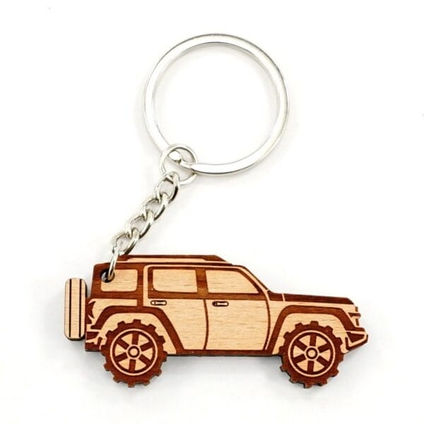 Personalised wooden keychain: Laser-engraved off-road vehicle design with metal keyring.