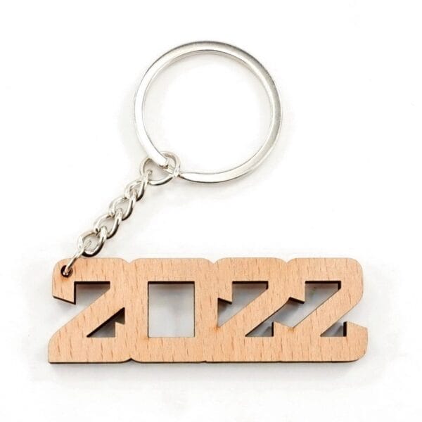 Personalised wooden keychain with 2022 cut-out design and metal ring. Great for laser-engraved Christmas designs.