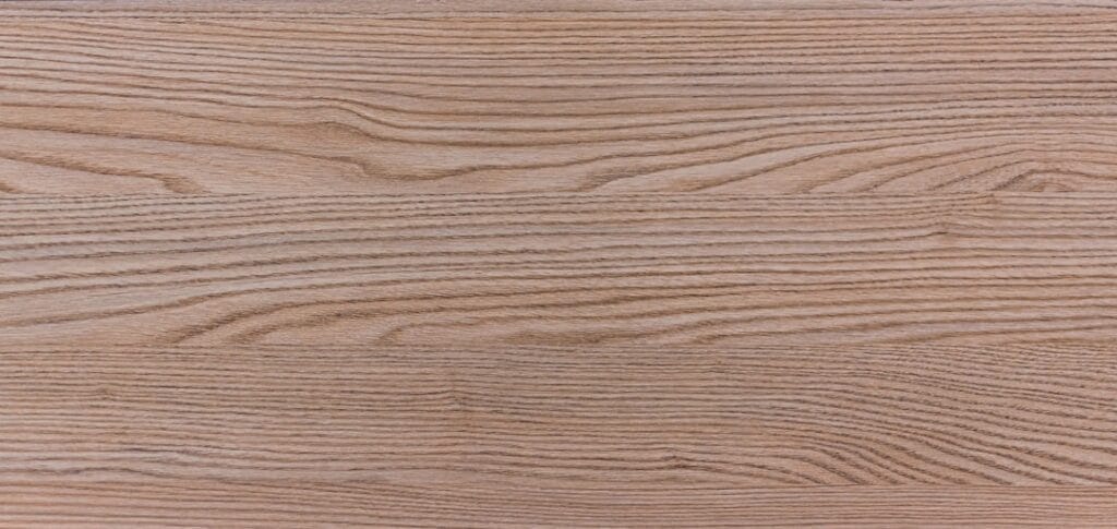 What’s MDF Wood? Close-up view of light brown wood grain, possibly MDF, plywood, or real wood.