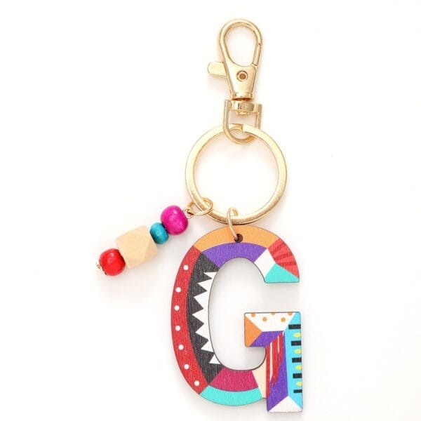 Colorful wooden letter G keychain with beads on a gold clasp