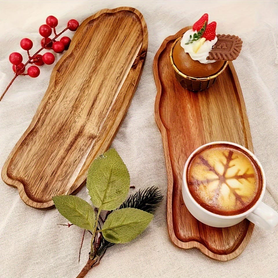 Two acacia wood cloud-shaped serving trays, one with coffee and dessert.
