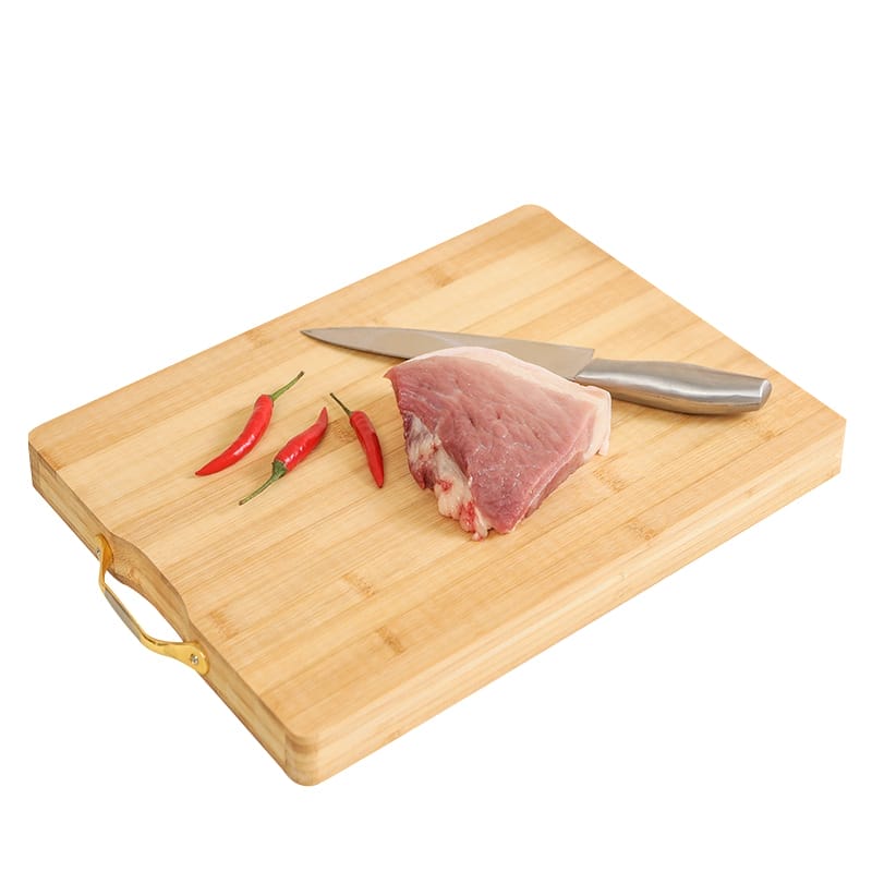 Bamboo cutting board with gold handle, raw pork, and chili peppers. Wholesale kitchen cutting boards.