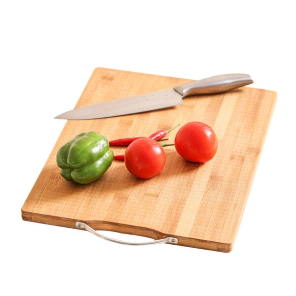 Bamboo cutting board with tomatoes, pepper, and knife. High-quality solid bamboo fruit cutting board from a leading manufacturer.