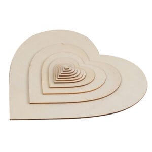 Set of nested wooden heart shapes, perfect for crafting or decoration. Circle wood pieces for DIY projects.