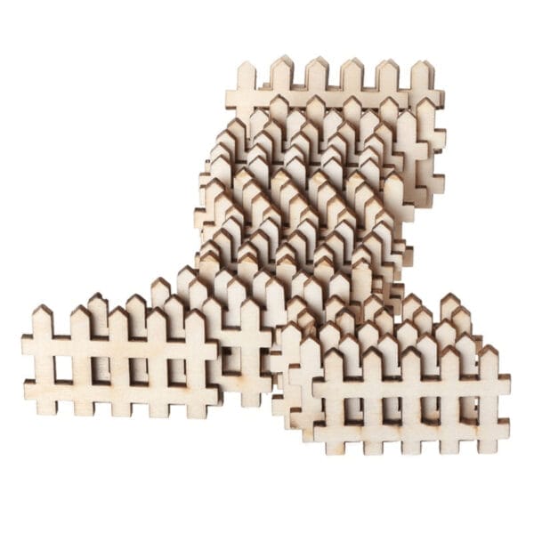 Stack of miniature wooden fences, ideal for craft projects. Custom wood craft pieces.