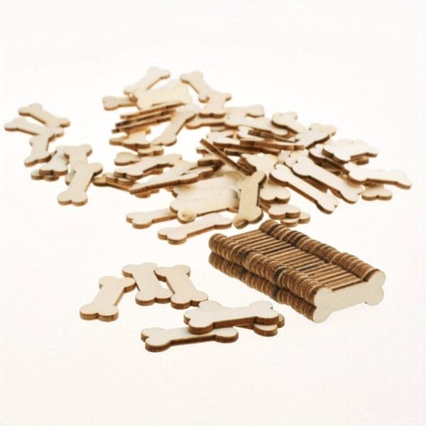 Scattered wooden dog bone cutouts; wholesale wooden craft supply.