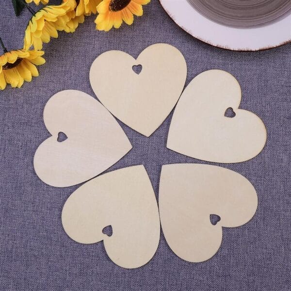 Five laser-cut wooden hearts, perfect for wholesale craft projects or custom decorations.