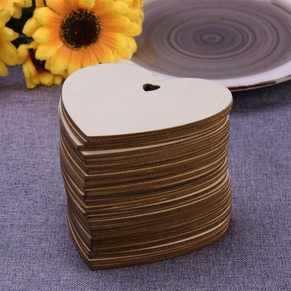 Stack of wholesale laser-cut wooden heart shapes; custom wood cutout signs.