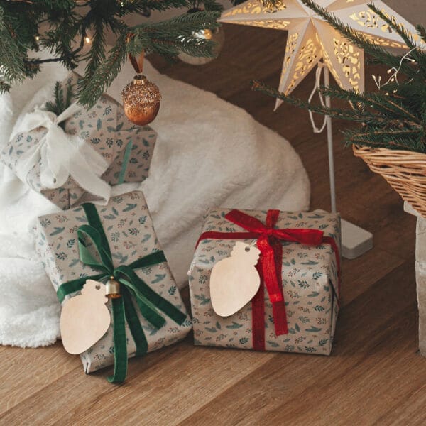 Christmas gifts with custom wooden ornaments and tags.