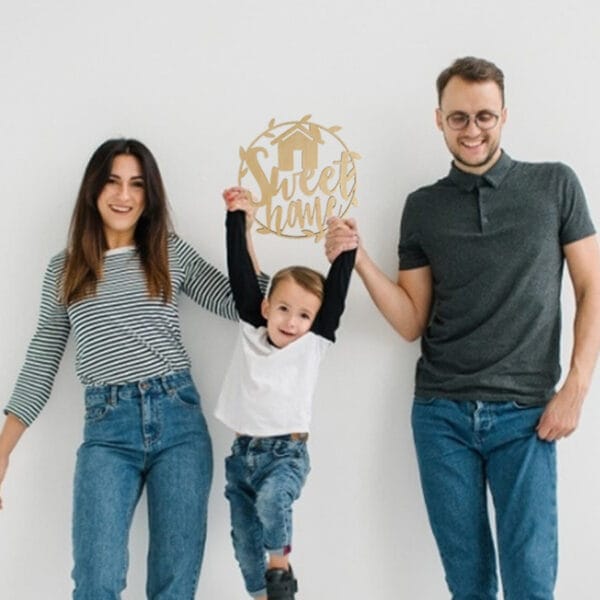 Happy family with custom "Sweet Home" wood sign