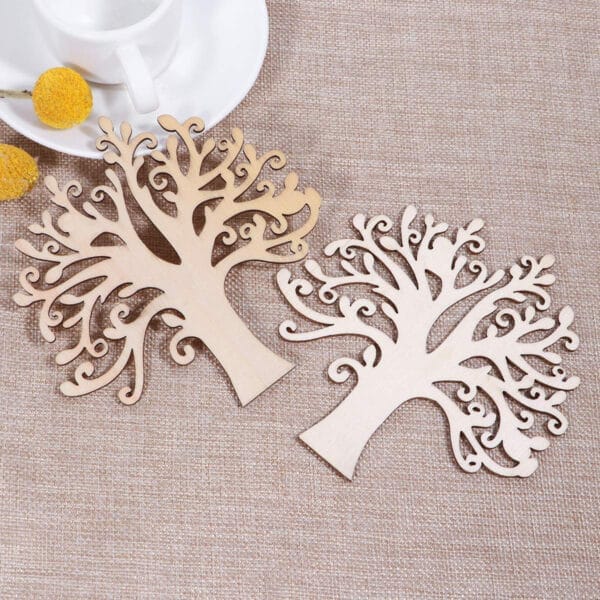 Two laser-cut wooden Christmas tree pendants. Custom wood pieces for crafting.