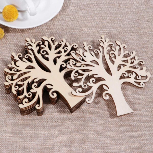 Stack of laser-cut wooden Christmas tree pendants. Custom wood pieces for crafting.