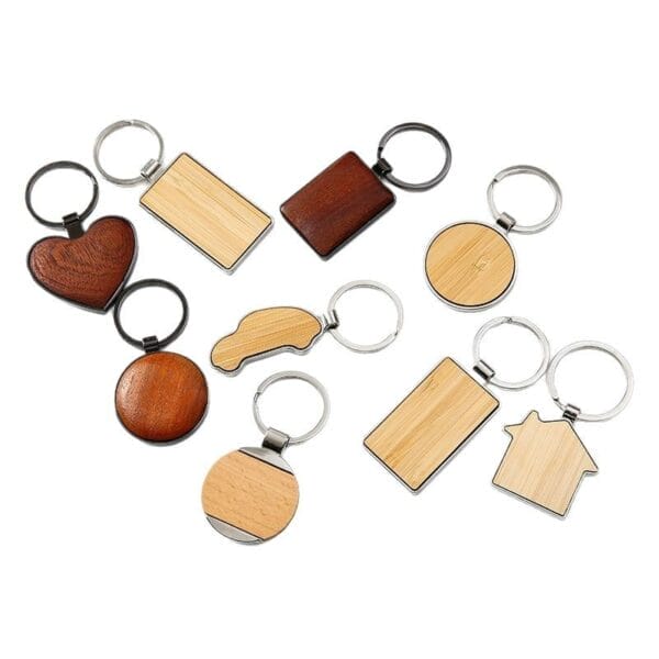Assortment of custom wooden keychains, including heart, car, and house shapes. Wholesale laser cut keychains available.