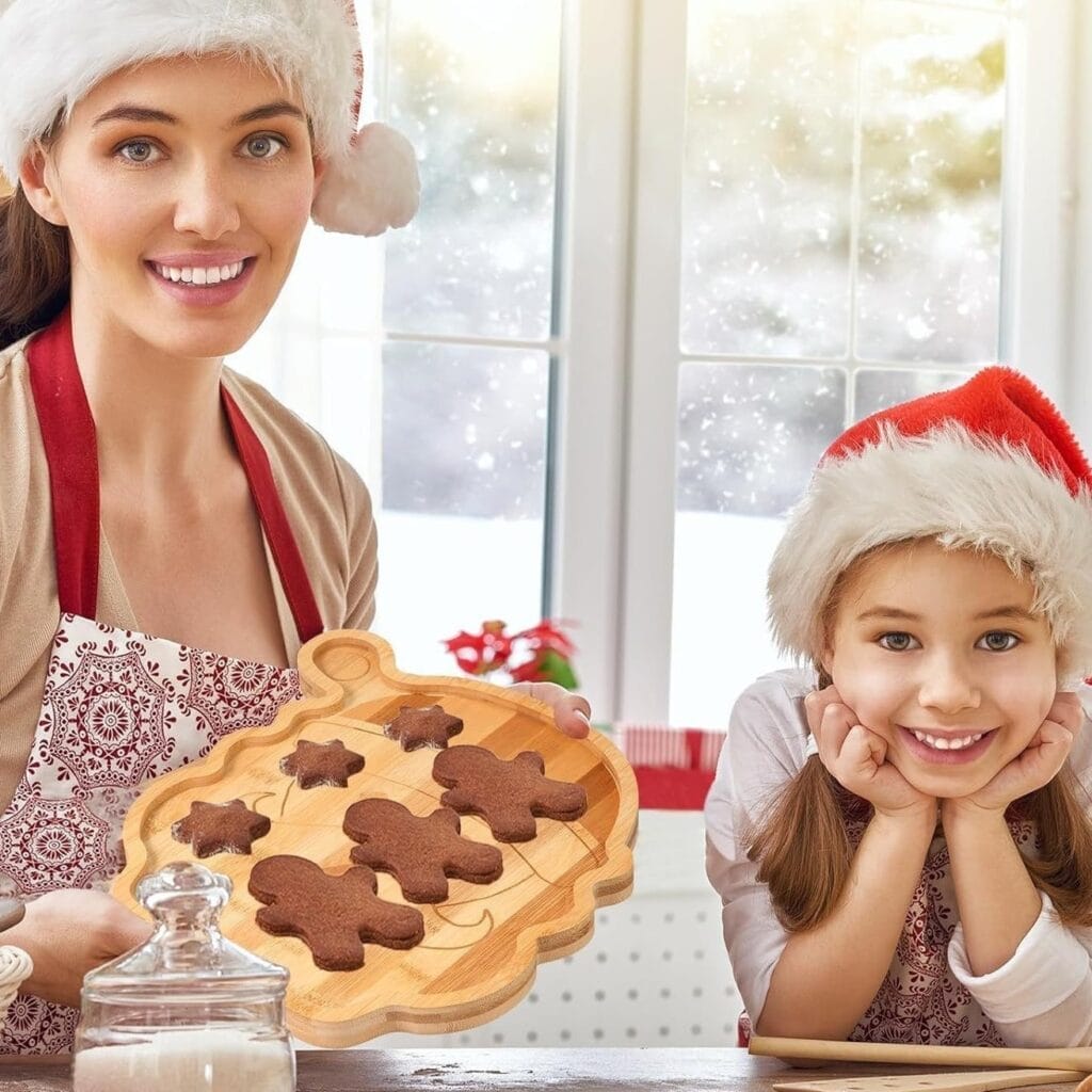Mother and daughter baking gingerbread men on a decorative wooden tray. Wholesale bamboo tray supplier.