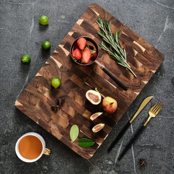 Factory-made walnut end-grain cutting board with fruit and herbs. Double-sided chopping board.