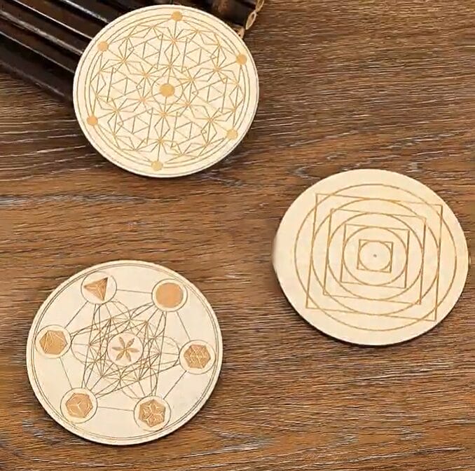 Set of three engraved coasters featuring geometric designs. Laser-cut and perfect for any home.