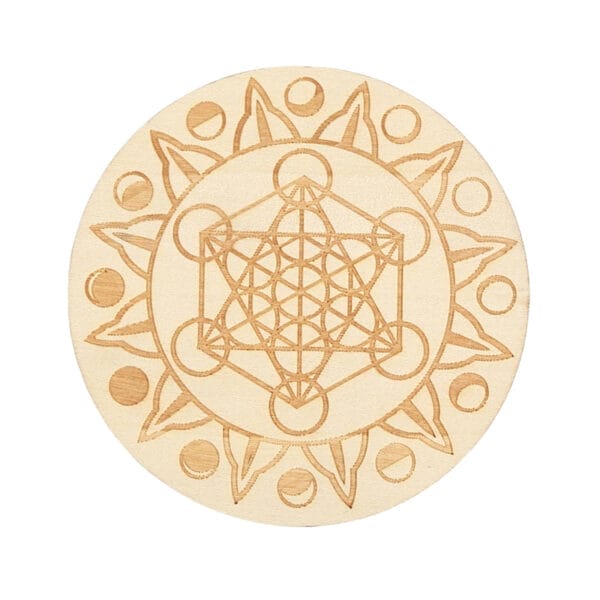Laser-cut wooden coaster with engraved mandala design. Intricate geometric pattern on beige wood.