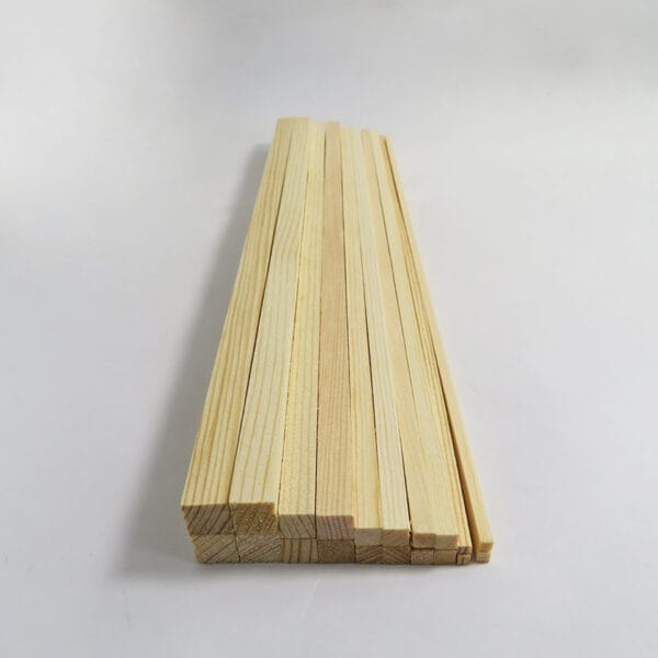 Wooden sticks for model building: A bundle of long, smooth balsa wood dowels, ideal for craft projects and model making.