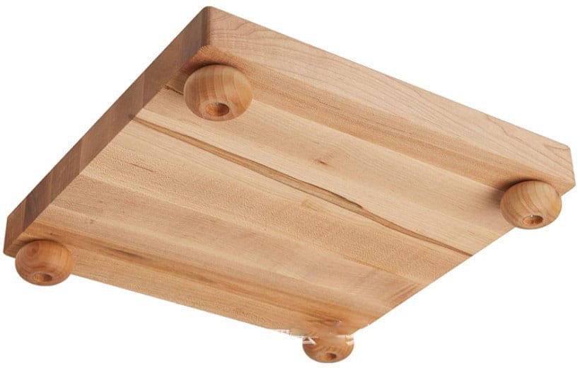 Large maple wood cutting board with four turned wooden feet. Ideal for distributors.
