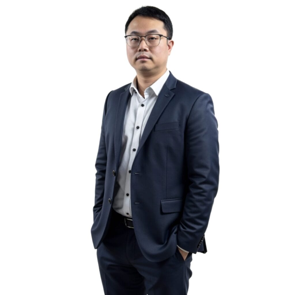 Portrait of a man in a dark blue suit and glasses