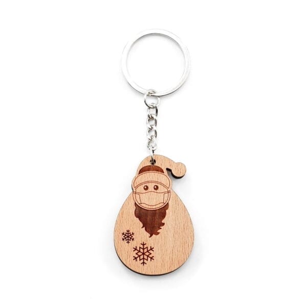 Wooden Christmas keychain: Santa Claus wearing a face mask, snowflakes. Personalized wooden key ring, holiday gift.