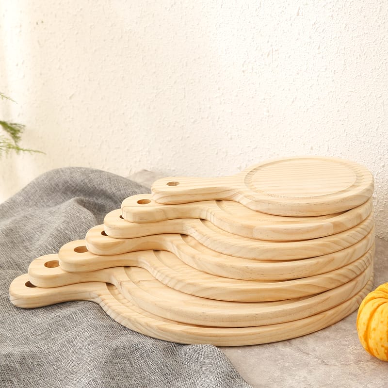 Stack of round pine wood trays wholesale with handles, perfect for restaurants. Wholesale supplier.