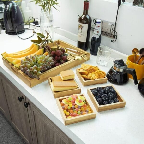 Bamboo trays filled with fruit, snacks, and sweets. Eco-friendly wooden trays perfect for wholesale.