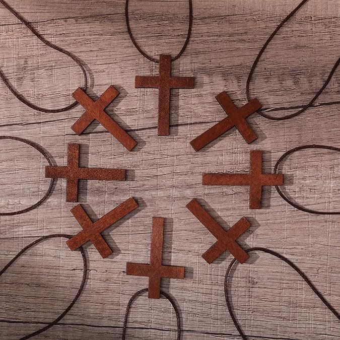 Assortment of small, brown wooden cross necklaces. Eco-friendly Easter and home decor.