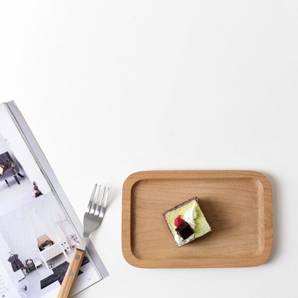 Rectangular beech wood tray with cake and fork. Wholesale supplier of small wood trays.