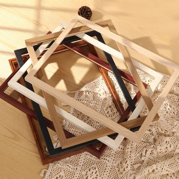 Stack of customizable solid wood picture frames in various colors and sizes. Wholesale options available.