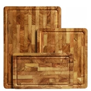 Set of three teak cutting boards, varying sizes. Perfect for kitchen prep.