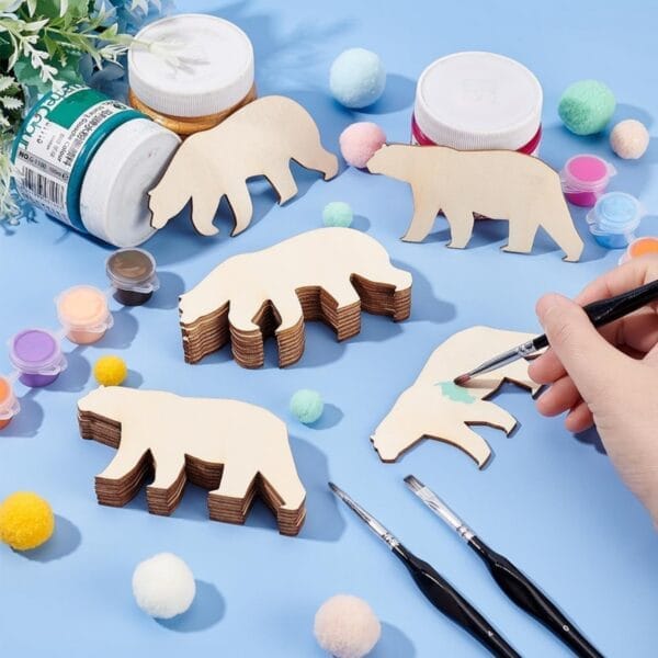 Unfinished wooden bear shapes and paint supplies for craft projects. Wholesale wooden pendants available.