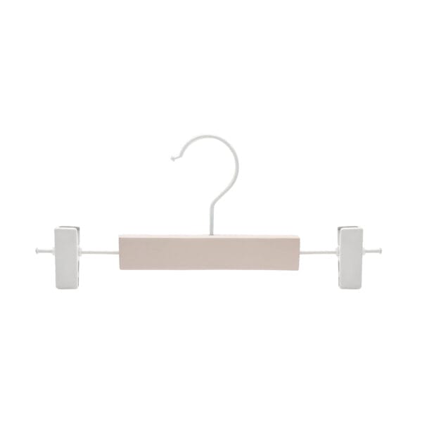 Pink wooden clothes hanger with white clips and metal hook; perfect for wholesale.