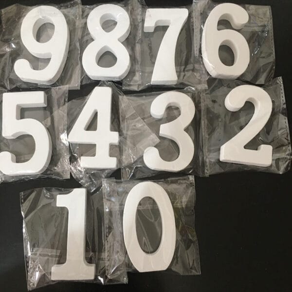 White wooden numbers 0-9, perfect for modern minimalist home decor. Wholesale available.