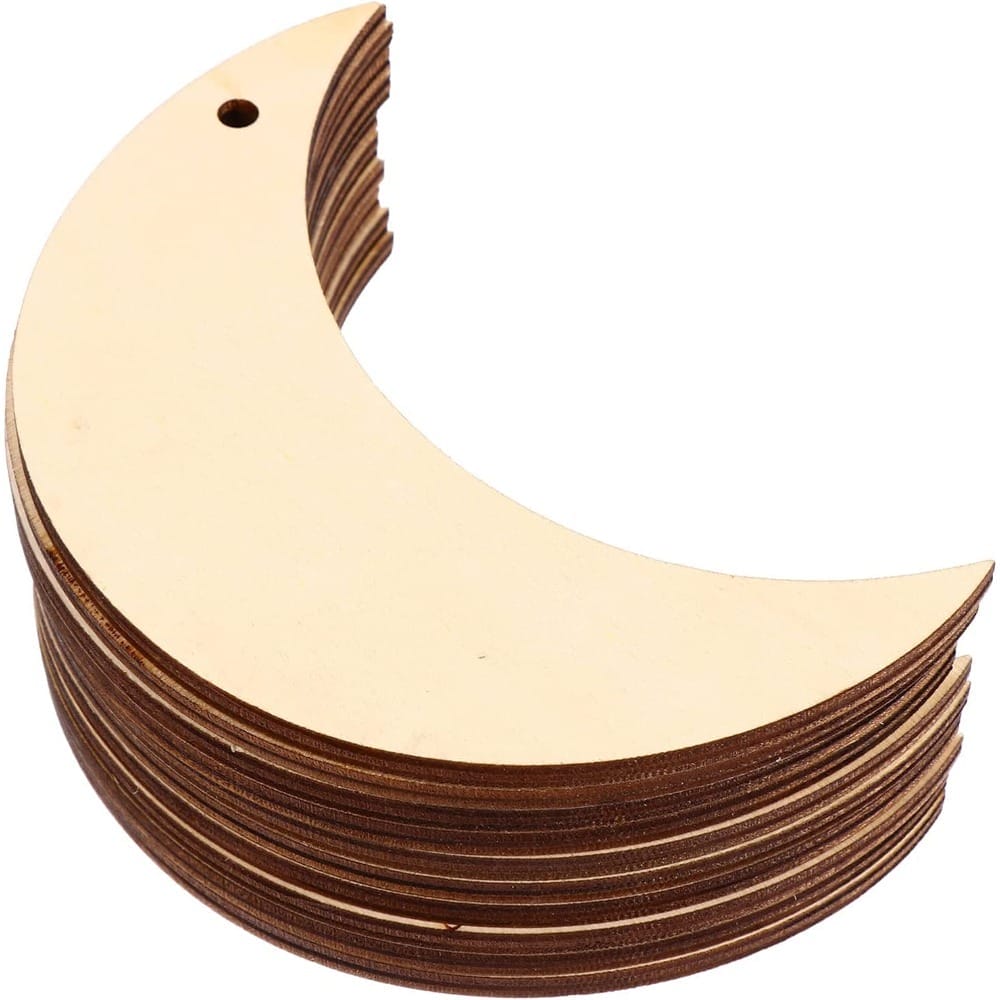 Stack of unfinished wooden moon cutouts, perfect for DIY crafts. Wholesale wooden cutouts hanging ornaments.
