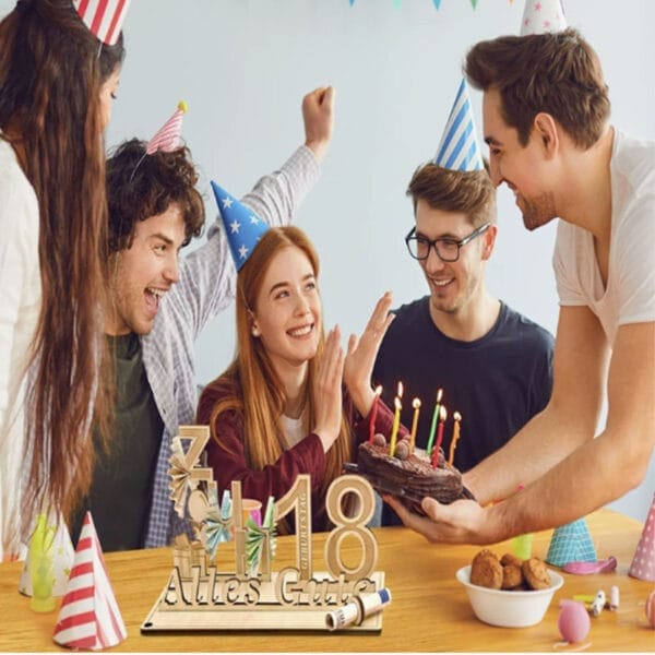 Friends celebrating an 18th birthday with a custom wooden "Alles Gute" cake topper. Wholesale wood alphabet letters decoration.