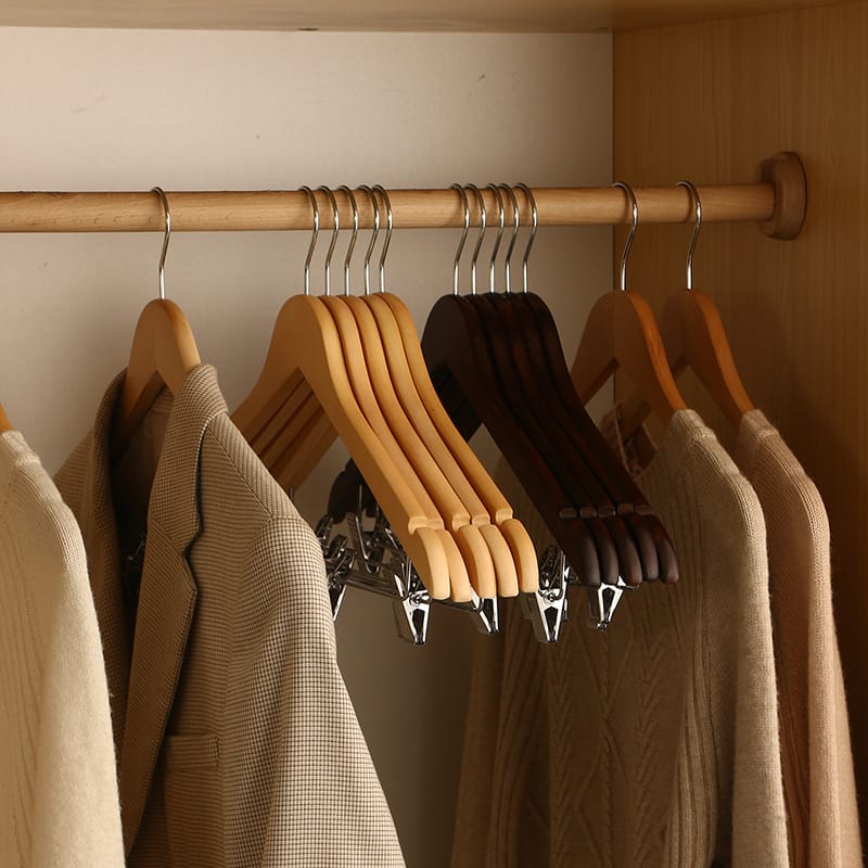 Wood Clothes Hangers Wholesale: Set of natural and dark brown wooden hangers with clips, ideal for closet organization and home use. Non-slip design.