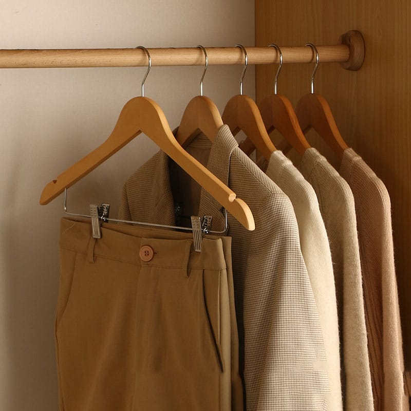 Wood clothes hangers with non-slip clips, ideal for home use. Wholesale options available.