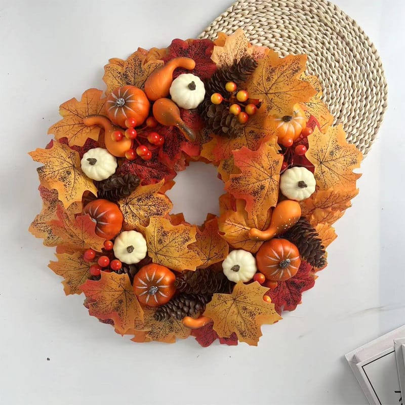 Autumn pumpkin wreath with fall leaves, gourds, and pinecones. Perfect for Thanksgiving or autumn decor.