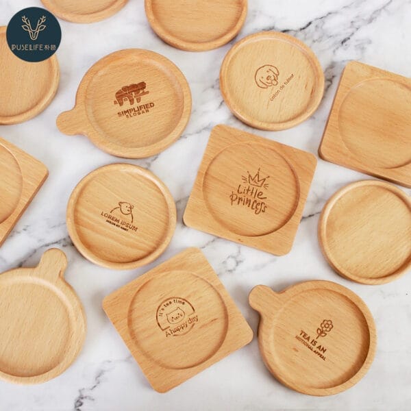 Assortment of custom engraved wood coasters with various logos and designs. Wholesale and distribution available.